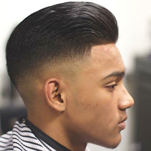 Brushed Back Hair with Mid Skin Fade