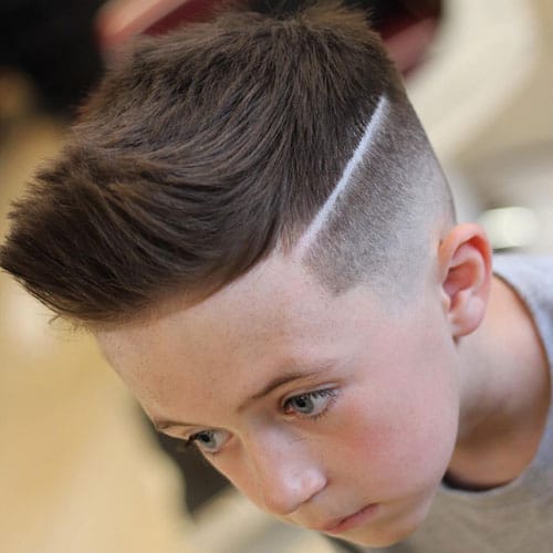 Cute Kids Fade Haircuts - Low Taper Fade with Hair Design and Longer Textured Natural Spiky Hair