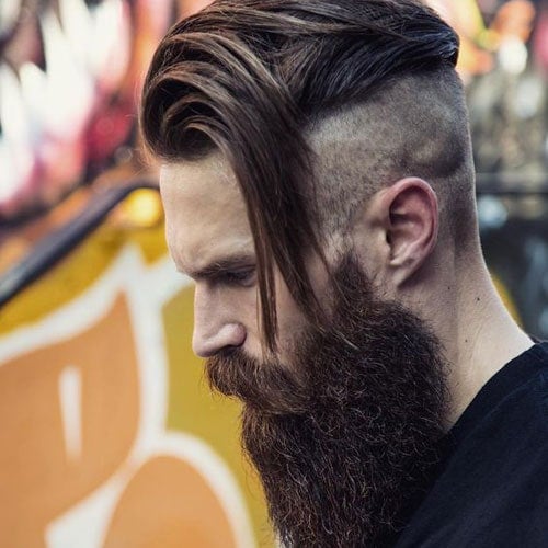 Disconnected Undercut with Long Side Swept Hair and Thick Beard