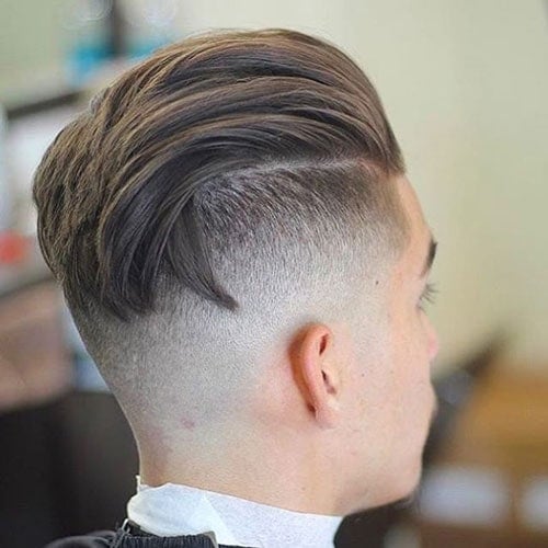 High Undercut Fade with Textured Slicked Back Hair