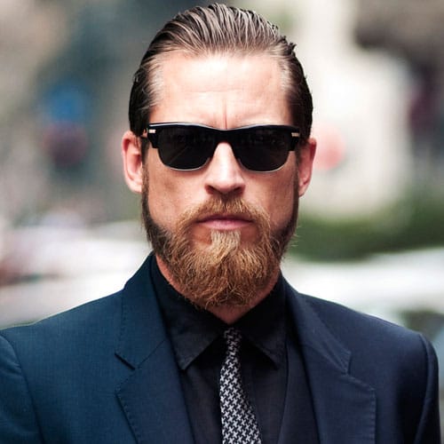 Long Slicked Back Hair with Thick Beard