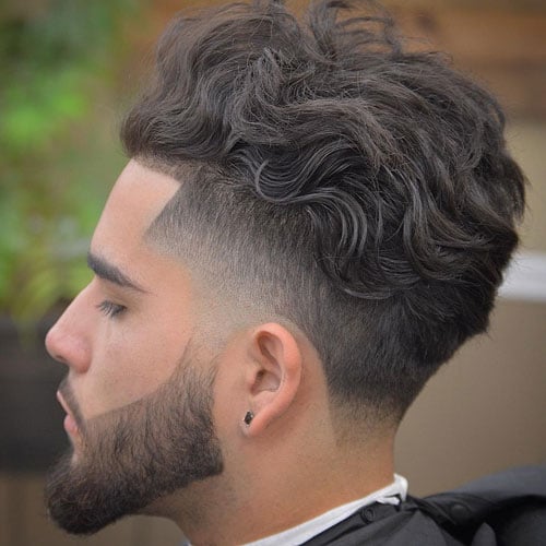 Long Wavy Brushed Back Hair + Low Fade