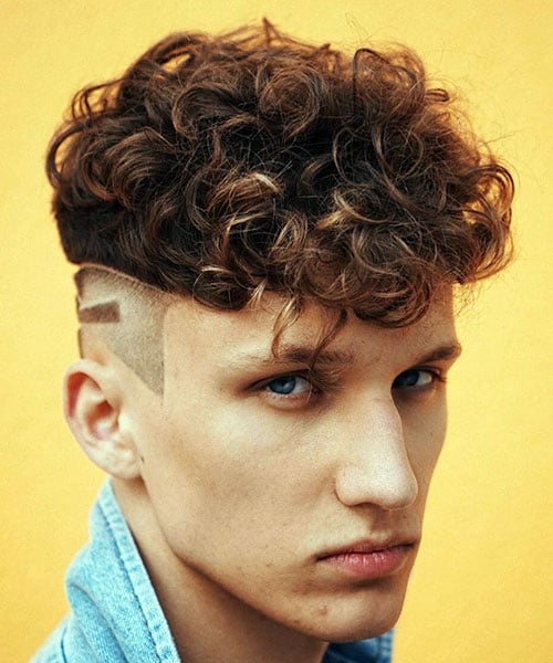 Modern Curls with Shaved Sides and Design