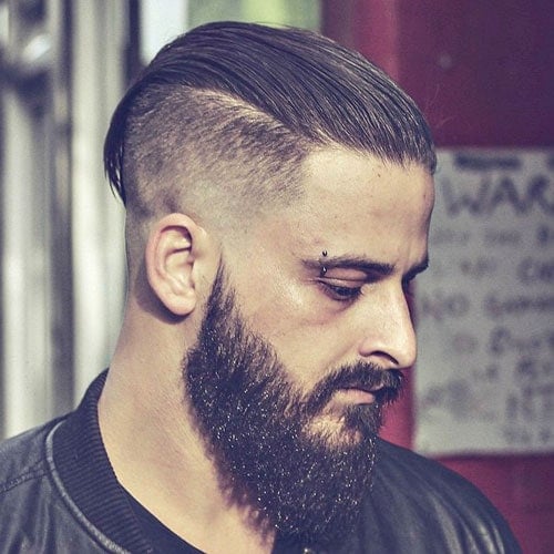 Slicked Back Hair with High Fade and Thick Beard