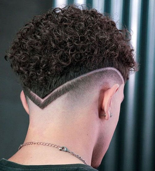 Tight Curls with Drop Fade and Shaved Design